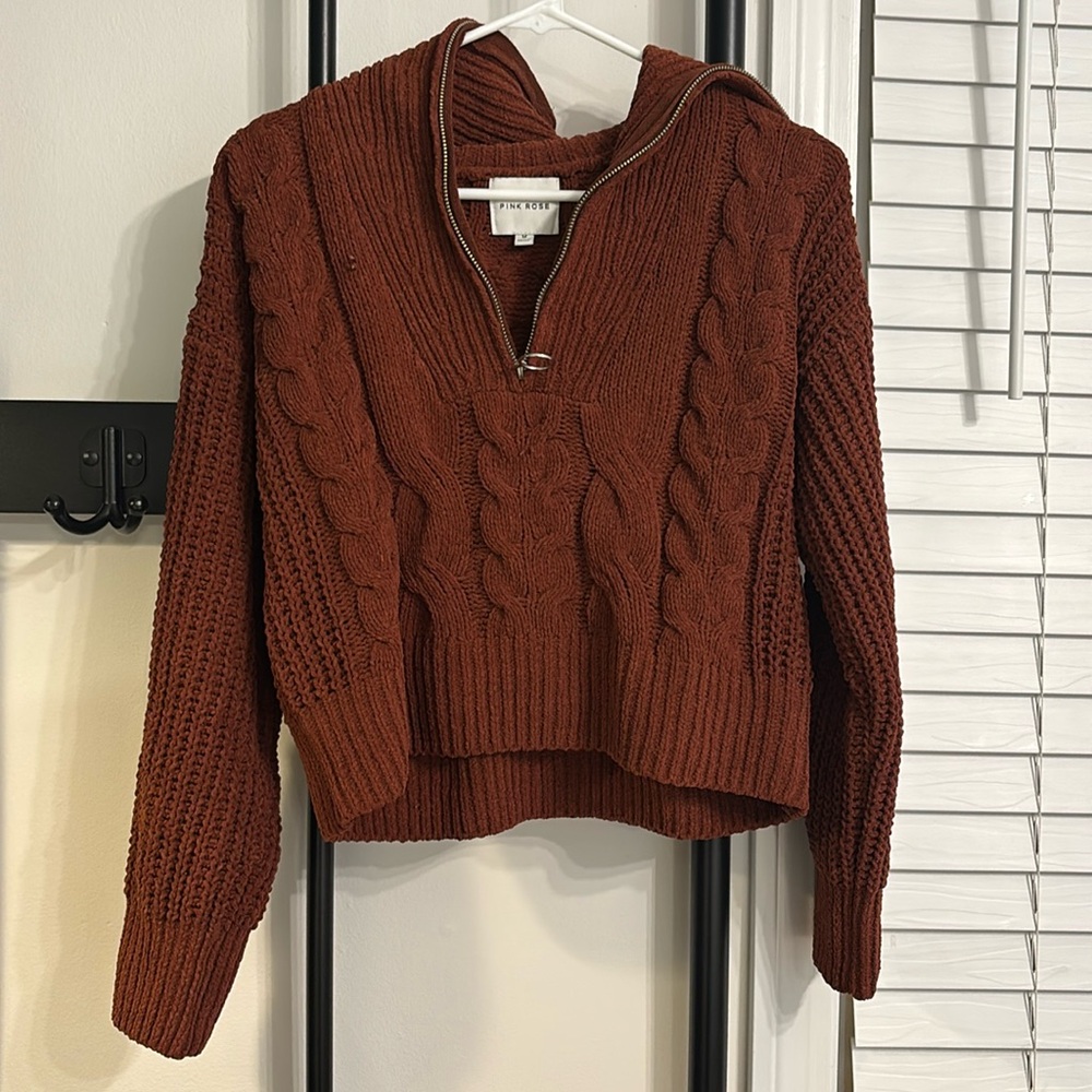 Pink rose worn sweater